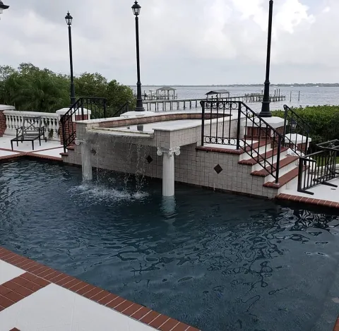 Pool with a waterfall feature near the bay