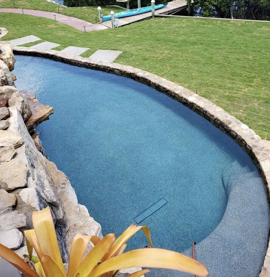The backyard pool with clear blue water